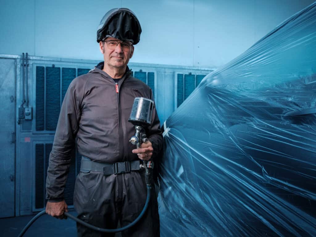 Autospuiter in beeld met autospuit. Den Elzen Rotterdam-Zuid
